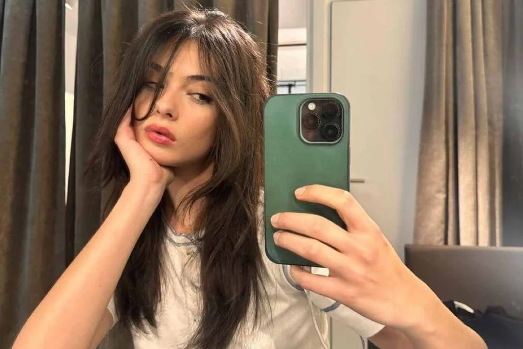 Deva Cassel, daughter of Monica Bellucci, lights up the catwalk in a gold dress at Fashion Week